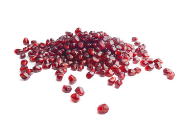 Pomegranate seeds over white background