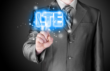 businessman is pushing his finger on lte button