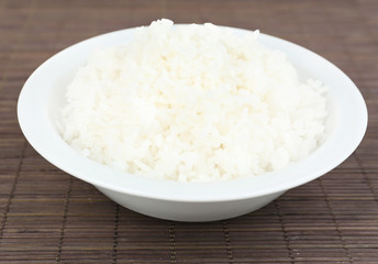 Cooked rice on bamboo background