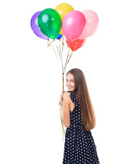 Woman with colorful balloons turning around