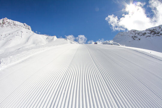 perfectly groomed empty ski piste