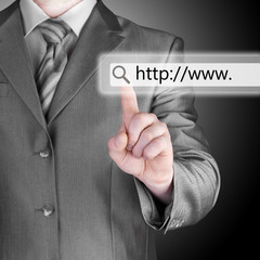 Businessman pushing virtual search bar