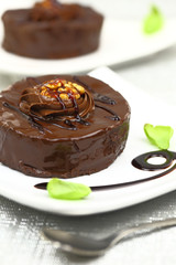 Chocolate dessert with decoration on white plate