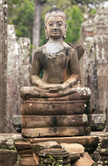 Ancient statue of Buddha in the temple of Angkor Wat.