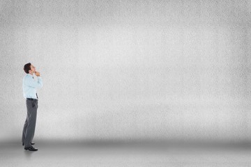 Obraz premium Composite image of thoughtful businessman with hand on chin