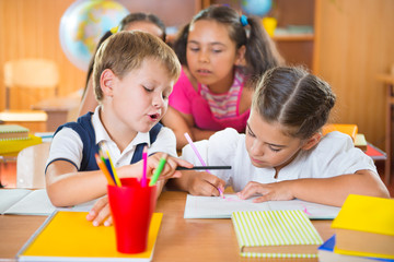 Obraz premium Happy pupils at school