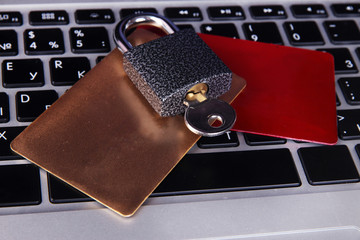 Credit cards and lock on keyboard close up