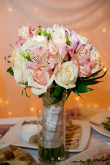 Wedding bouquet of orchids and roses