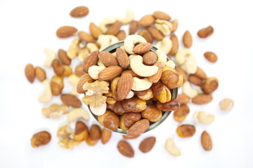 Mix of nuts close - up on white background