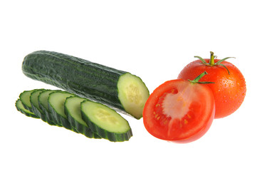 Sliced cucumber and tomatoes isolated on white