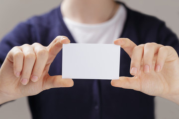 Obraz premium female teen hands holding business card