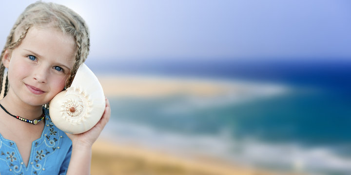 Summer beach, joy,  girl with shell at the beach