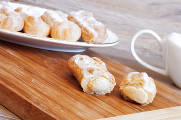 Appetizing eclairs with custard