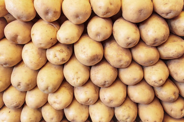 Fresh organic young potatoes sold on market