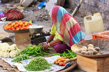Fotobehang Indian woman selling vegetables, Sadar Market, Jodhpur, India © donyanedomam