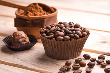 chocolate, coffee beans and cocoa on the wooden table