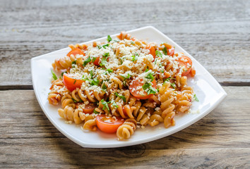Whole heat fusilli pasta with cheese and cherry tomatoes