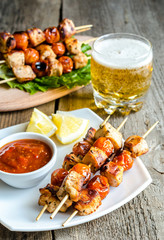 Grilled chicken skewers with cherry tomatoes
