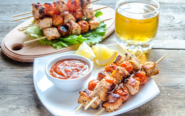 Grilled chicken skewers with cherry tomatoes