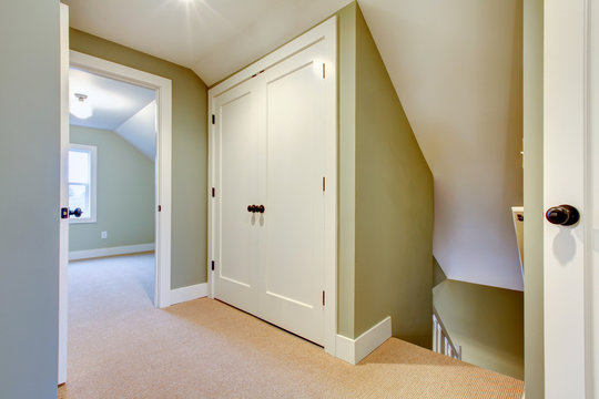 Bright hallway with built-in small storage room