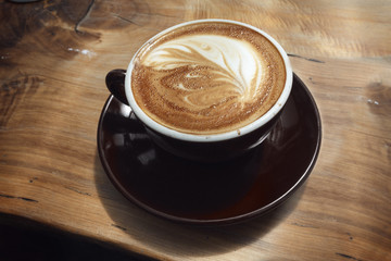 Coffee cup on old wooden table