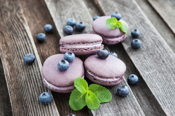 Violet french macarons with blueberry and mint