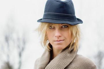 Pretty blonde girl with fedora hat