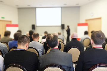Fototapeta premium The audience listens in a conference hall