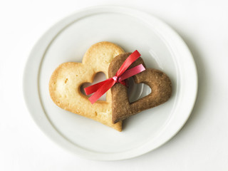 two heart-shaped cookies tied together