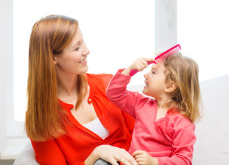 happy mother and daughter with comb - Powered by Adobe