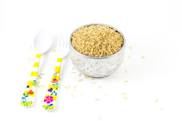 Uncooked brown rice on white background