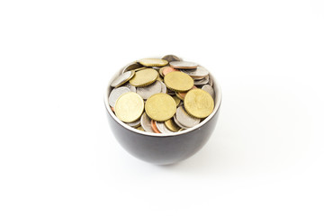 Coin in cup on white background