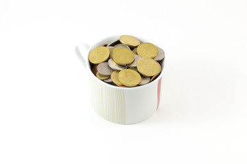 Coin in cup on white background