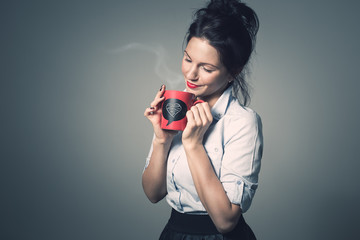 Attractive young women with red lips holding red ceramic cup