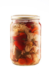 Mixed pickled vegetables in glass jar