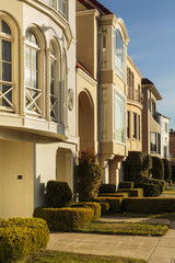 Row of upscale houses showing driveway and yard