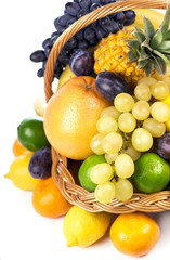 Fresh fruit in a wicker basket isolated on the white