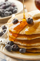 Homemade Buttermilk Pancakes with Blueberries and Syrup