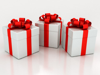 white gift boxes with red ribbon