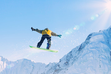Naklejka na ściany i meble Snowboarder in jump