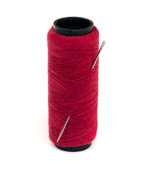 red thread and needle.