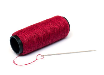 red thread and needle.