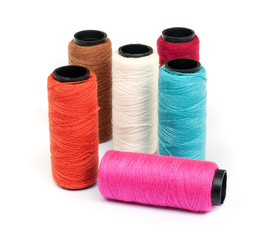 Spool of coloured  thread .