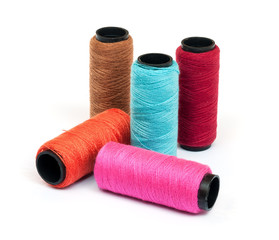 Spool of coloured  thread.