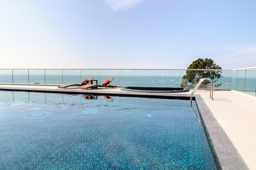 Relax Sun-beds near a swimming pool