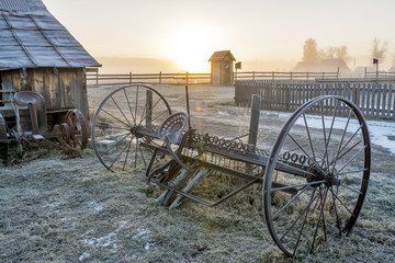 Fototapeta na wymiar Sunrise on a country farm and equipment