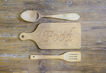 Cutting board with the word, food.