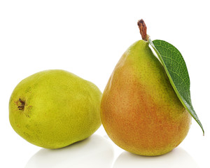 Pears with green leaves isolated on white background.
