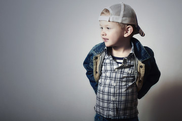 Child. Funny Little Boy in Jeans.Trucker cap.plaid shirt.Denim