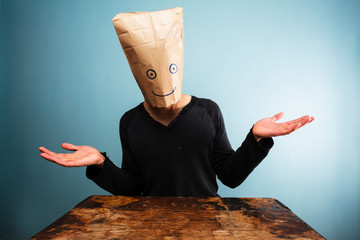 Confused man with bag over head - obrazy, fototapety, plakaty